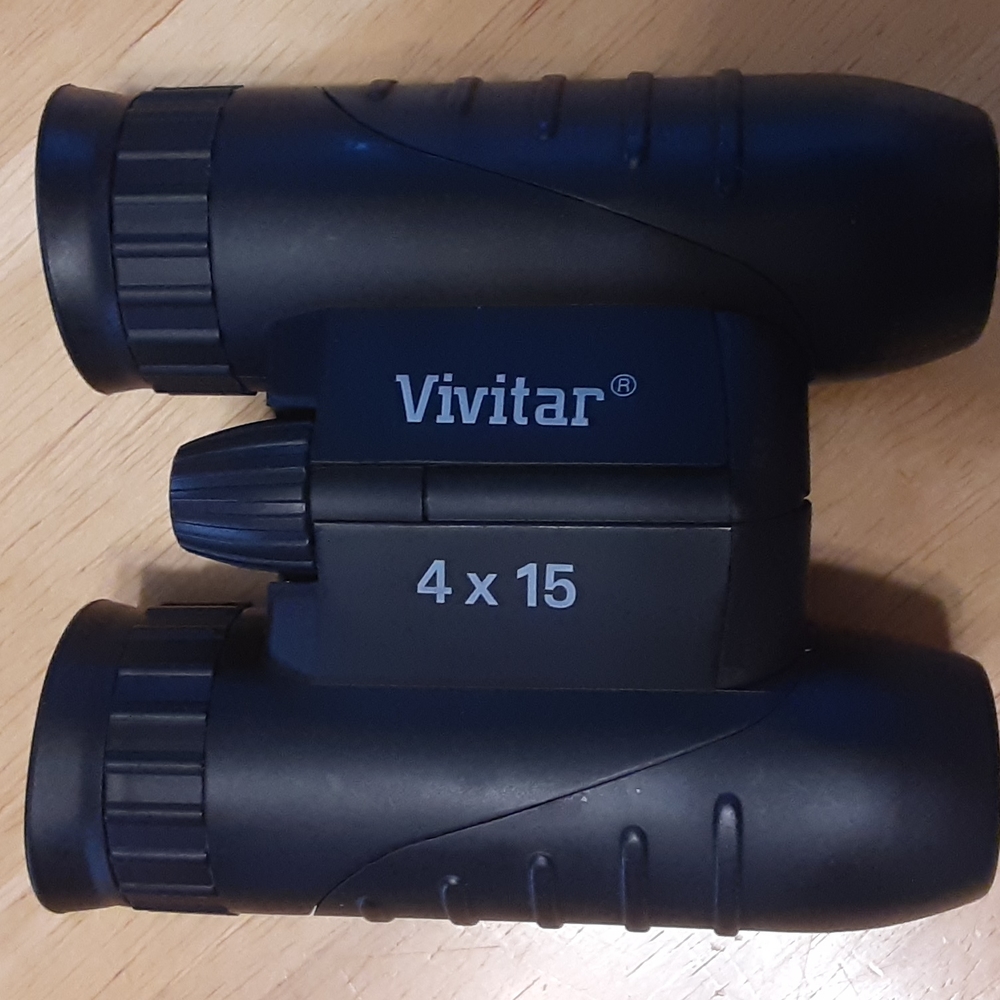 Vivitar binoculars 4 x 15 with original case, strap and box.